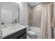 Full bathroom features a shower-tub combo, tile surround, and a modern vanity with storage at 7782 93Rd N St, Seminole, FL 33777
