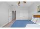 Bedroom includes a double closet, ceiling fan, and carpet. Additional rooms available via doorways at 7782 93Rd N St, Seminole, FL 33777