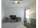 Bonus living room with ceiling fan, desk, and neutral colors offers a flexible living space at 7782 93Rd N St, Seminole, FL 33777