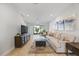 Inviting living room with abundant natural light, open floor plan, and cozy seating at 7782 93Rd N St, Seminole, FL 33777