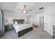 Spacious main bedroom featuring a large bed, stylish furniture, and a peaceful atmosphere at 7782 93Rd N St, Seminole, FL 33777