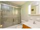 Bathroom featuring tiled shower and floors, modern vanity with hard surface countertop, and updated plumbing fixtures at 800 71St N Ave # 8, St Petersburg, FL 33702