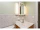 Bathroom featuring tiled shower and floors, modern vanity with hard surface countertop, and updated lighting fixtures at 800 71St N Ave # 8, St Petersburg, FL 33702