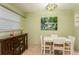 Lovely dining area featuring a decorative light fixture and a peaceful painting at 800 71St N Ave # 8, St Petersburg, FL 33702