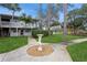 Beautiful condo showcasing mature trees, well-manicured landscaping, and ample natural light at 800 71St N Ave # 8, St Petersburg, FL 33702