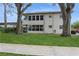 Charming condo featuring well-maintained exterior, large windows, and a lush green lawn at 800 71St N Ave # 8, St Petersburg, FL 33702