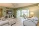 Spacious living room with tile flooring, large windows, and comfortable furnishings at 800 71St N Ave # 8, St Petersburg, FL 33702