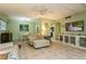 Inviting living room with tile floors, an adjacent dining area, and comfortable seating at 800 71St N Ave # 8, St Petersburg, FL 33702