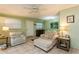 Cozy living room featuring tile floors, a ceiling fan, and comfortable seating at 800 71St N Ave # 8, St Petersburg, FL 33702