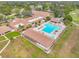 Aerial view of community pool, clubhouse and recreational facilities at 860 Glen More Ct # B, Palm Harbor, FL 34684