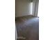 A bright bedroom with space for a sitting area and large windows at 90 S Highland Ave # 224, Tarpon Springs, FL 34689