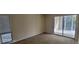 A large room with windows and door for natural light at 90 S Highland Ave # 224, Tarpon Springs, FL 34689