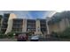 A charming apartment building with a well-maintained exterior and balconies in a desirable neighborhood at 90 S Highland Ave # 224, Tarpon Springs, FL 34689