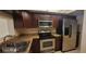 Functional kitchen with stainless steel appliances, ample cabinet space, and updated countertops at 90 S Highland Ave # 224, Tarpon Springs, FL 34689