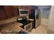 A fully equipped kitchen with stainless steel appliances and sleek countertops at 90 S Highland Ave # 224, Tarpon Springs, FL 34689