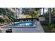 Resort style pool with outdoor seating and lush landscaping at 90 S Highland Ave # 224, Tarpon Springs, FL 34689