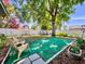 Spacious backyard featuring well-manicured lawn, mature tree, and play equipment at 903 Setter Ct, Seffner, FL 33584