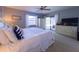 Bedroom featuring natural light, sliding glass doors, and dresser storage at 903 Setter Ct, Seffner, FL 33584