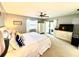 Bright bedroom with ample natural light, a ceiling fan, and access to the outdoor living space at 903 Setter Ct, Seffner, FL 33584