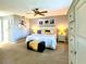 Spacious bedroom featuring neutral tones, a ceiling fan, and stylish decor creating a calming atmosphere at 903 Setter Ct, Seffner, FL 33584