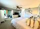 Spacious bedroom with a ceiling fan, neutral tones, and access to outdoor living space at 903 Setter Ct, Seffner, FL 33584