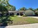 Charming single-Gathering home with a well-manicured lawn, mature trees, and welcoming curb appeal at 903 Setter Ct, Seffner, FL 33584