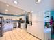 Bright kitchen showcasing white cabinets and countertops with stainless steel appliances at 903 Setter Ct, Seffner, FL 33584