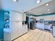 Bright kitchen featuring white cabinetry, stainless steel appliances, and tile flooring at 903 Setter Ct, Seffner, FL 33584