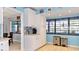 Bright kitchen with white cabinets, tile flooring, stainless steel appliances, and adjacent dining area, great for entertaining at 903 Setter Ct, Seffner, FL 33584
