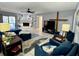 Comfortable living room with fireplace, plenty of seating, and stylish decor at 903 Setter Ct, Seffner, FL 33584