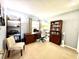 Office space with built-in bookshelves, a computer desk, and a comfortable chair at 903 Setter Ct, Seffner, FL 33584