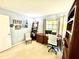Bright home office featuring a modern desk, chair, and built-in shelving for ample storage at 903 Setter Ct, Seffner, FL 33584