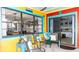 View of patio area with colorful accent walls and furniture with dining and seating areas at 903 Setter Ct, Seffner, FL 33584