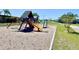 Outdoor playground showcasing play equipment, swings, and play structures with lake view at 903 Setter Ct, Seffner, FL 33584