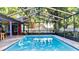 Enclosed swimming pool with brickwork and exterior seating, perfect for entertaining guests at 903 Setter Ct, Seffner, FL 33584