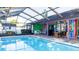 Enclosed swimming pool with brickwork and exterior seating, perfect for entertaining guests at 903 Setter Ct, Seffner, FL 33584