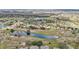 Breathtaking aerial view of the community showcasing lush greenery, ponds, and well-maintained homes at 1015 Harefield Cir, Sun City Center, FL 33573