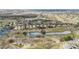 Stunning aerial view of a charming residential community featuring ponds and beautifully landscaped surroundings at 1015 Harefield Cir, Sun City Center, FL 33573