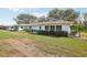 Spacious backyard with a patio, perfect for outdoor living and entertaining in a tranquil setting at 1015 Harefield Cir, Sun City Center, FL 33573