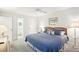 Bedroom featuring carpet flooring, neutral colored walls, and natural lighting at 1015 Harefield Cir, Sun City Center, FL 33573