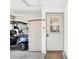 Welcoming home entrance featuring a golf cart, side storage and a secure front door at 1015 Harefield Cir, Sun City Center, FL 33573