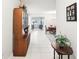 Inviting home foyer featuring tile flooring and views into the living and dining area at 1015 Harefield Cir, Sun City Center, FL 33573