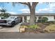 Inviting single-story home with a well-kept lawn and lush landscaping, enhancing curb appeal at 1015 Harefield Cir, Sun City Center, FL 33573