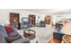 Open-concept living room with built-in bookshelves and comfortable furnishings at 1015 Harefield Cir, Sun City Center, FL 33573