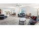 Open-concept living room and dining area offering ample natural light and neutral tones at 1015 Harefield Cir, Sun City Center, FL 33573