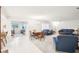 Bright and spacious living room featuring carpet flooring and comfortable seating at 1015 Harefield Cir, Sun City Center, FL 33573