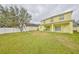 Large backyard with green grass and a white fence, great for outdoor activities at 10730 Shady Preserve Dr, Riverview, FL 33579