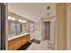 Bright bathroom featuring double sinks, a soaking tub, and a separate shower area at 10730 Shady Preserve Dr, Riverview, FL 33579