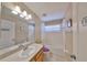 Bathroom featuring a vanity, toilet, shower and tub combination with tile flooring at 10730 Shady Preserve Dr, Riverview, FL 33579