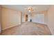 Large carpeted bedroom with ceiling fan, closet, and an entry to another room at 10730 Shady Preserve Dr, Riverview, FL 33579